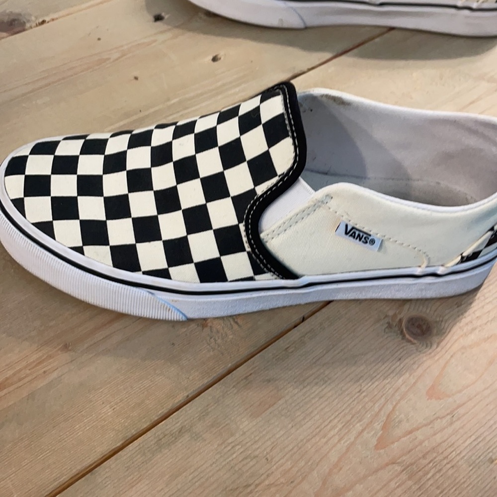 Vans black and white checkered slip-ons